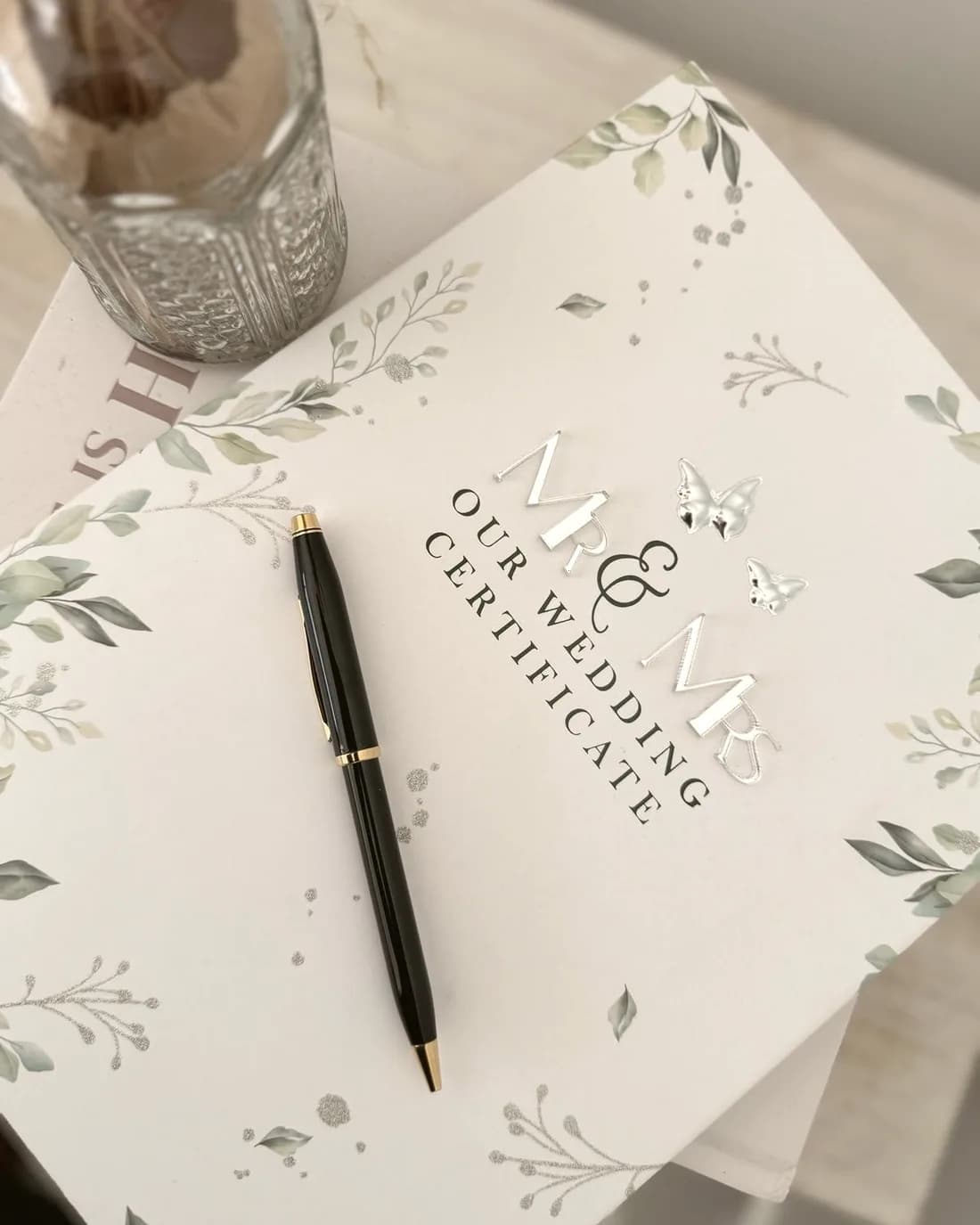 Marriage documentation and pen resting on a desk